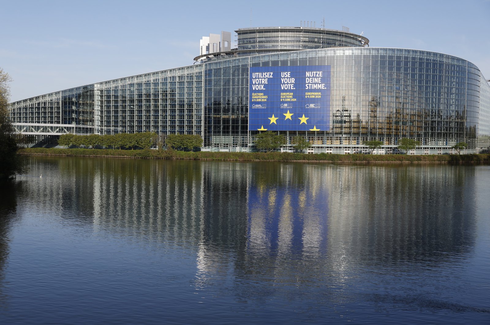 A giant canvas promoting the European elections is seen on the European Parliament, in Strasbourg, eastern France, April 11, 2024. (AP Photo)