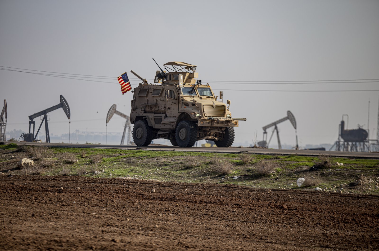 A U.S. military vehicle on a patrol in the countryside near the town of Qamishli, Syria, Dec. 4, 2022. (AP File Photo)