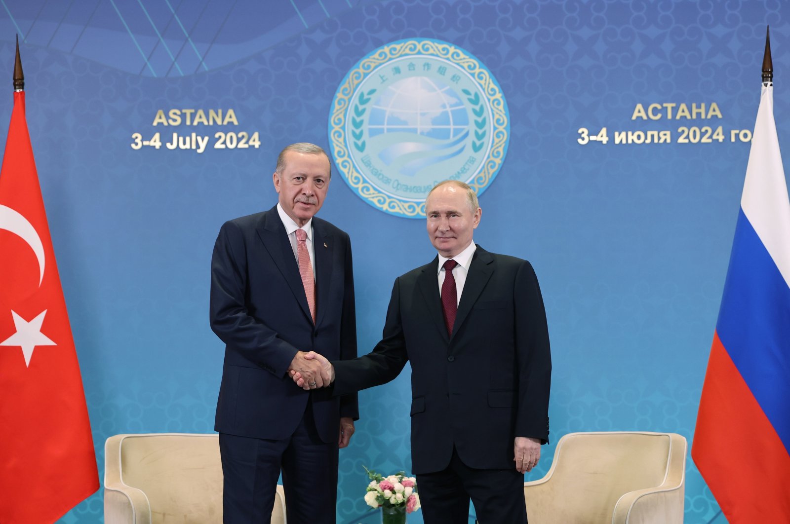President Recep Tayyip Erdoğan (L) shakes hands with Russian President Vladimir Putin, Astana, Kazakhstan, July 3, 2024. (AA Photo)
