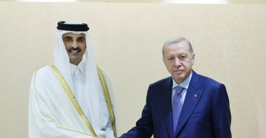 President Recep Tayyip Erdoğan (R) shakes hands with Qatari Emir Sheikh Tamim bin Hamad Al Thani (L) during their meeting, Astana, Kazakhstan, July 4, 2024. (AA Photo)