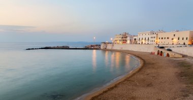 Beach and waterfront buildings at dusk, Lecce, Italy, Jan 1, 2014. (Getty Images)