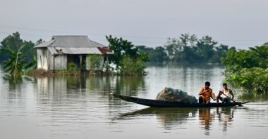 Fishermen at work in a flood-affected area of Sylhet, northeastern Bangladesh, June 21, 2024. (AFP Photo)