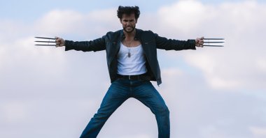 Ozer Tetik resembles Hugh Jackman&#039;s Wolverine character and captivates fans with movie-like poses both at work and on the streets, Türkiye, June 30, 2024. (AA Photo)