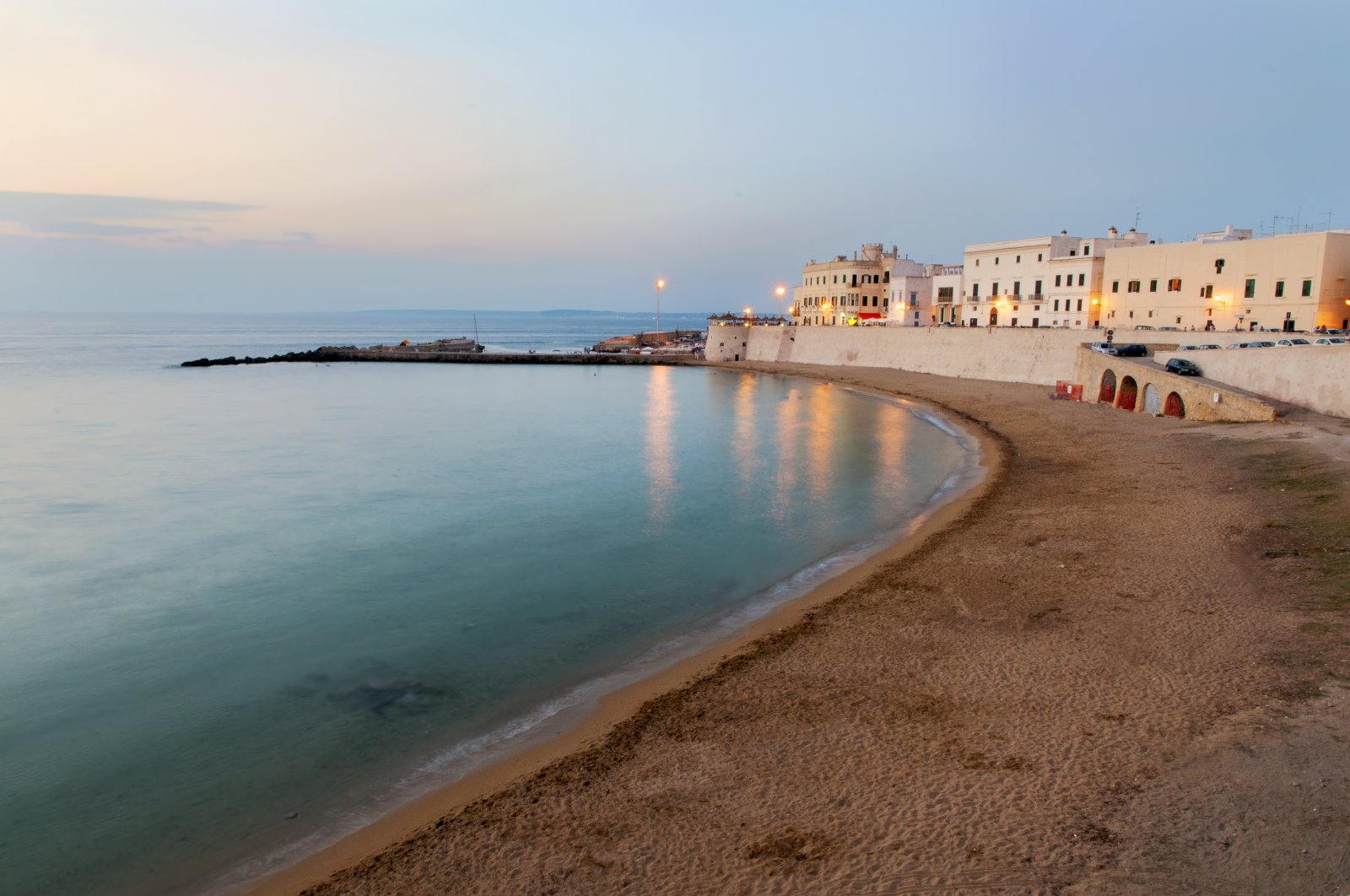 Beach and waterfront buildings at dusk, Lecce, Italy, Jan 1, 2014. (Getty Images)