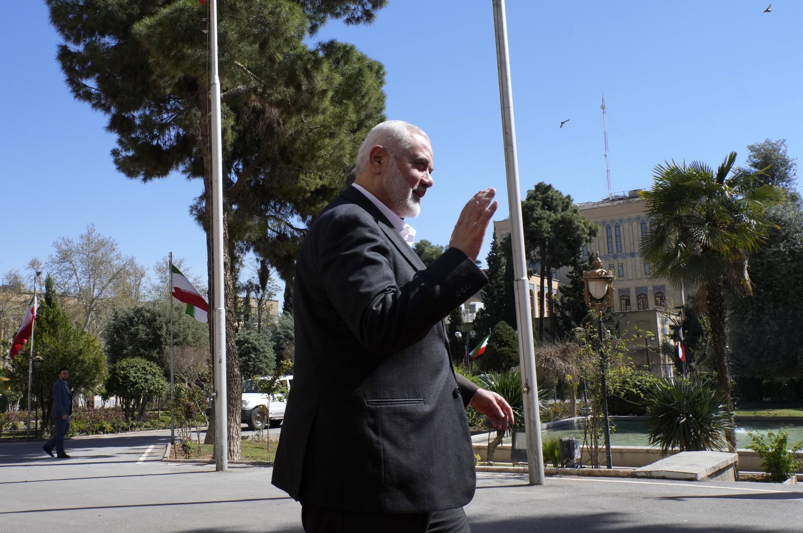 Hamas chief Ismail Haniyeh waves to the media in Tehran, Iran, March 26, 2024. (AP Photo)