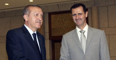 Syrian leader Bashar Assad (R) shakes hands with then-Prime Minister Recep Tayyip Erdoğan (L) at al-Shaab presidential palace, Damascus, Syria, Oct. 11, 2010. (AP Photo)
