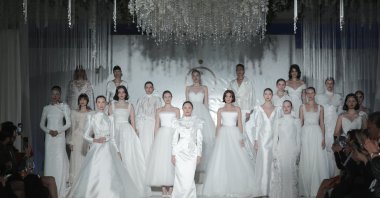 Models during a wedding dress fashion show featuring designs by Özlem Süer, Istanbul, Türkiye, Feb. 25, 2022. (Getty Images Photo)