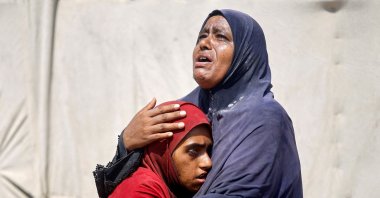 Palestinian people, who fled the eastern part of Khan Younis after they were ordered by the Israeli army to leave their neighborhood, react upon their arrival at Nasser hospital, Khan Younis, Gaza Strip, Palestine, July 2, 2024. (Reuters Photo)