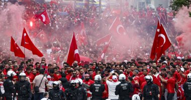 Turkish fans march toward the stadium ahead of a Euro 2024 Group F match against Georgia, Dortmund, Germany, June 18, 2024. (AP Photo)