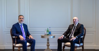 Foreign Minister Hakan Fidan and Azerbaijani President Ilham Aliyev pose for a photo in Shusha, Azerbaijan, July 5, 2024. (AA Photo)