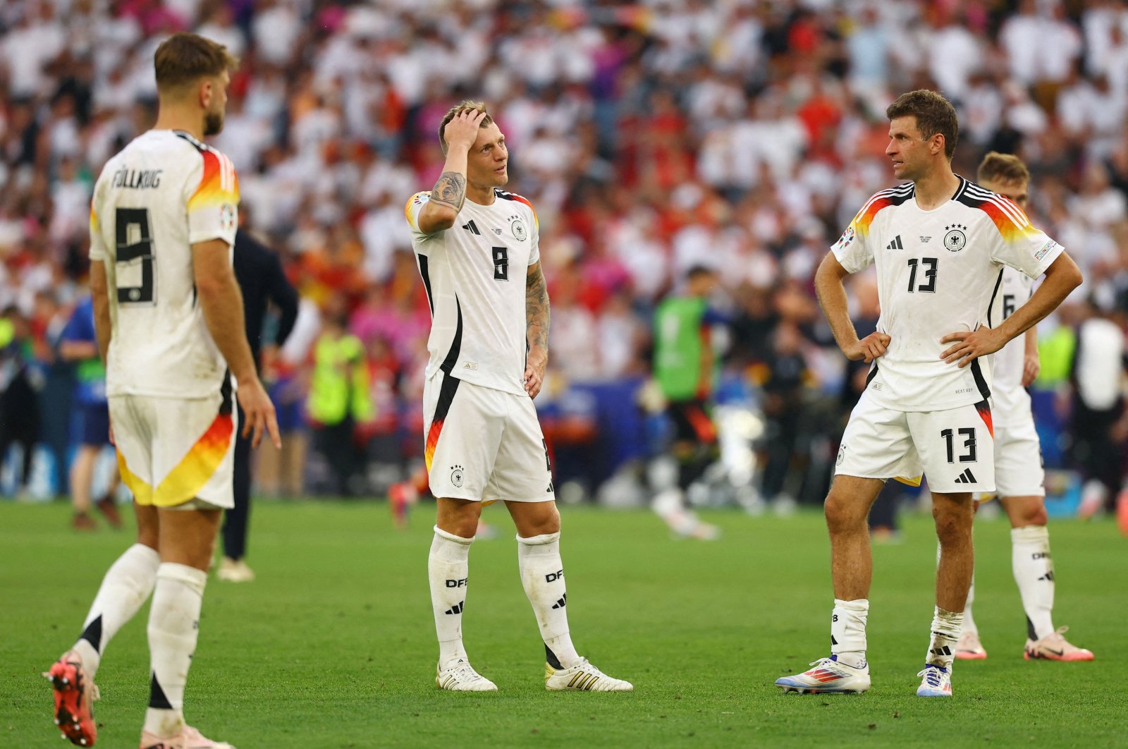  Germany&#039;s Toni Kroos and Thomas Muller look dejected after the match with Spain in Stuttgart, July 5, 2024. (EPA Photo) 