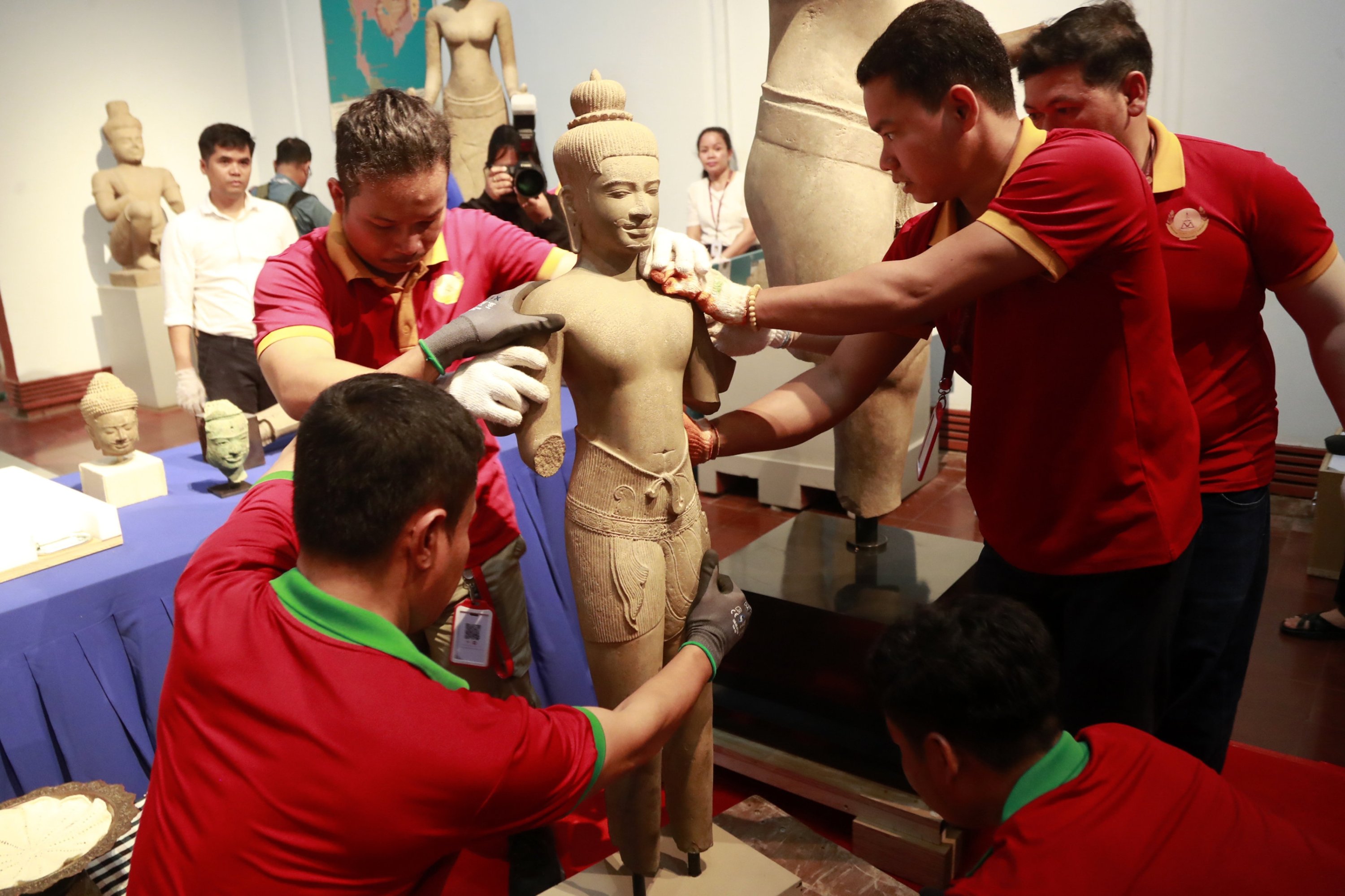 Cambodian officials prepare artifacts to be displayed during a handover ceremony at the National Museum in Phnom Penh, Cambodia, July 4, 2024. (EPA Photo)