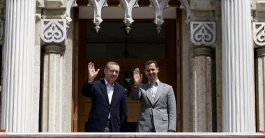 Then-Prime Minister Recep Tayyip Erdoğan (L) and Syrian leader Bashar Assad wave before a meeting, Istanbul, Türkiye, May 9, 2010. (AP Photo)