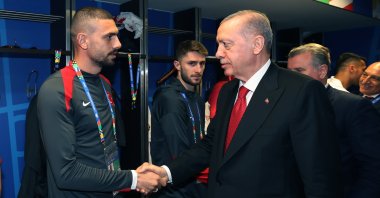 Turkish President Recep Tayyip Erdoğan shakes hand with national footballer Merih Demiral, in Berlin, Germany, July 6, 2024. (DHA Photo)