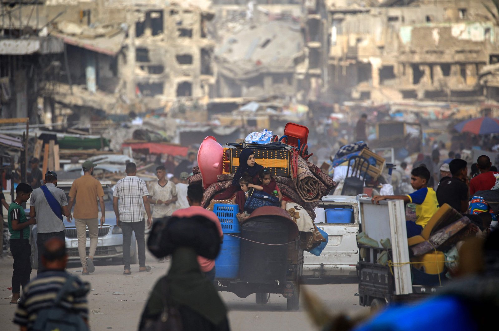 Displaced Palestinians from areas in east Khan Younis arrive in the city as they flee after the Israeli army issued a new evacuation order for parts of the city and Rafah, in the southern Gaza Strip, Palestine, July 2, 2024. (AFP Photo)