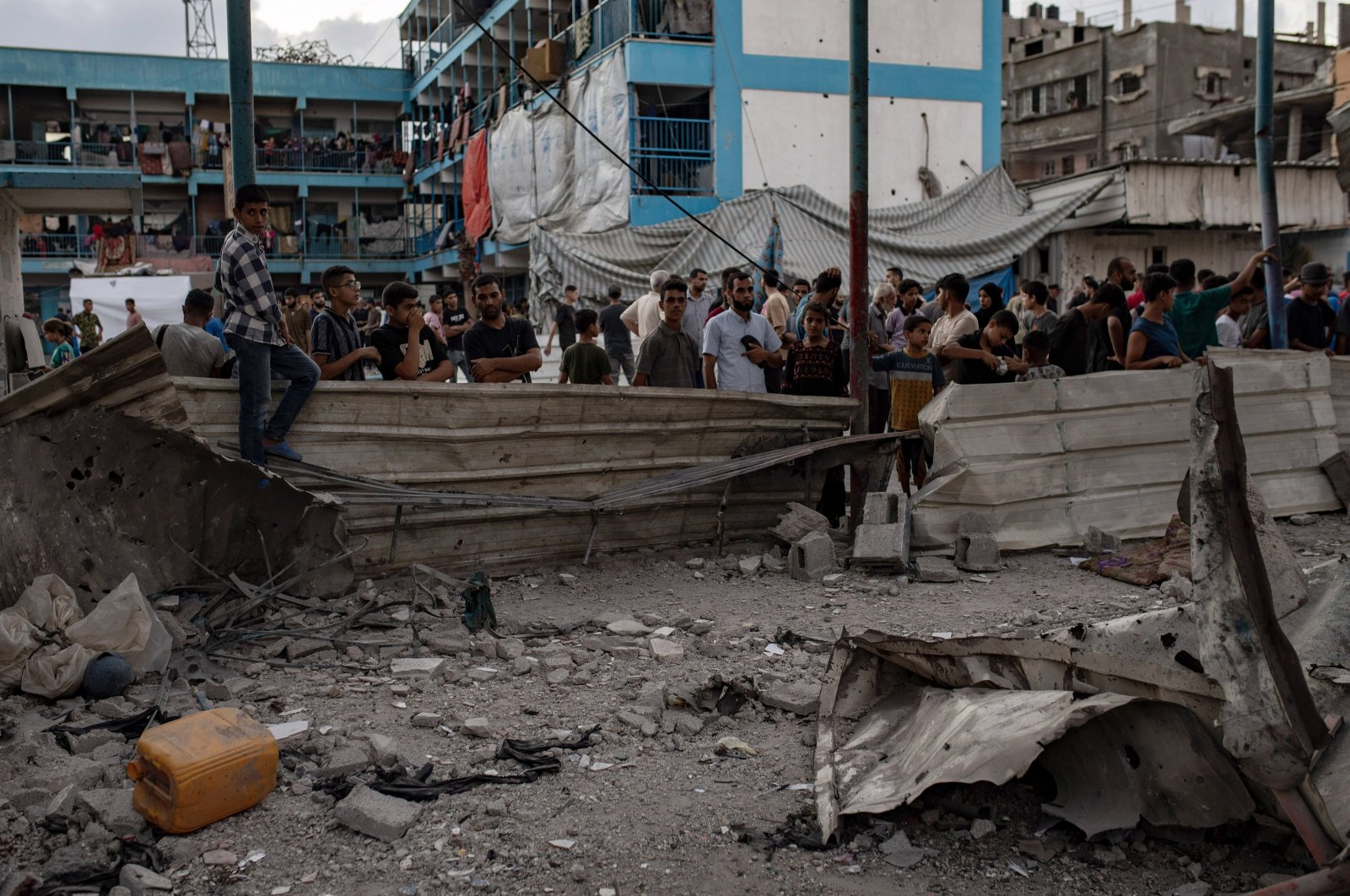 Palestinian people look at the damage after the Israeli air strike hit UNRWA's al-Jaouni School, Gaza, Palestine, July 6, 2024. (EPA Photo)
