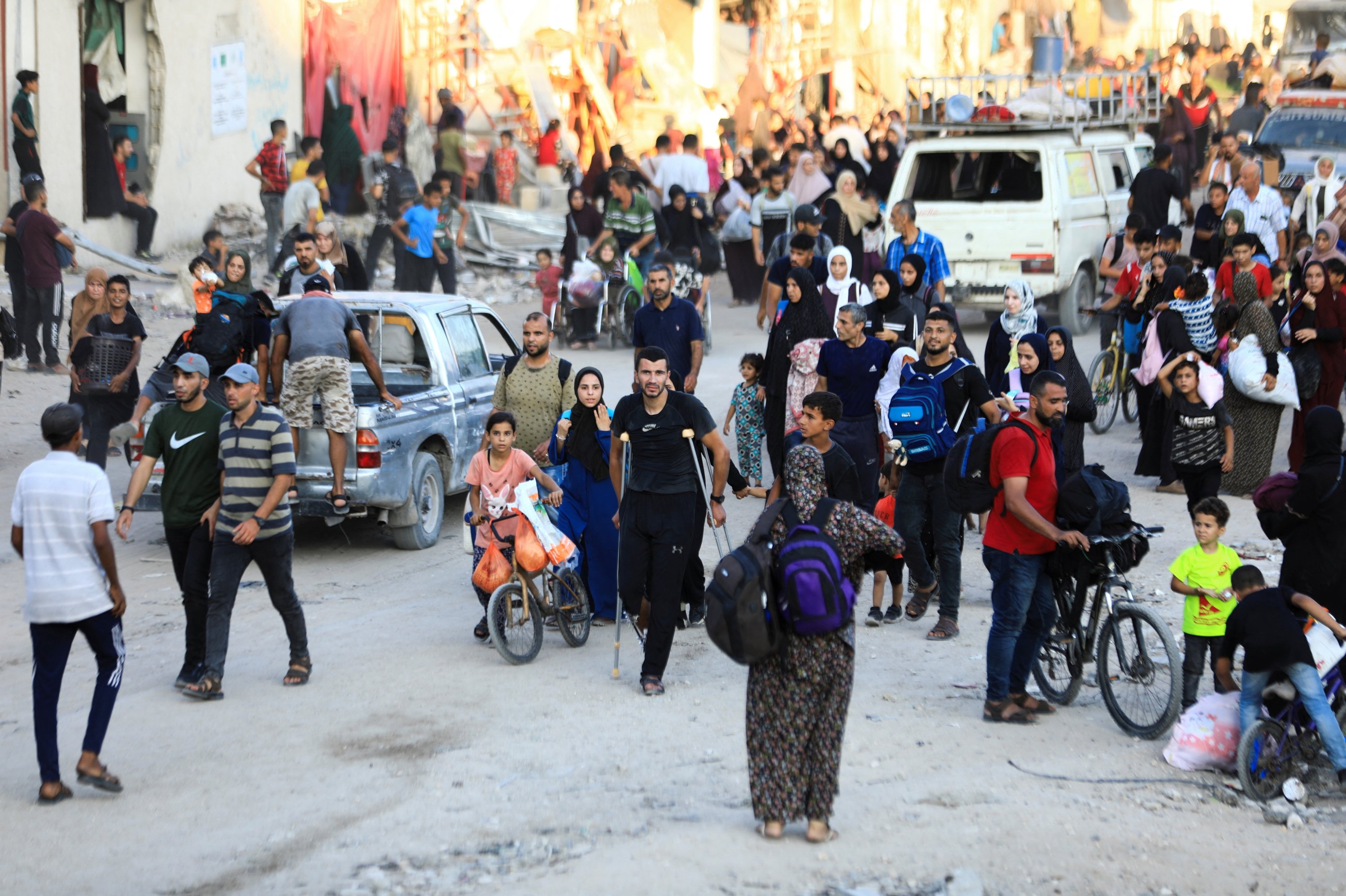 Palestinians, who fled the eastern part of Gaza City after they were ordered by Israeli army to evacuate their neighborhoods, carry their belongings, Gaza City, Palestine, July 7, 2024. (Reuters Photo)