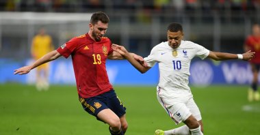 Spain's Aymeric Laporte (L) battles for possession with France's Kylian Mbappe during the UEFA Nations League 2021 Final match at San Siro Stadium, Milan, Italy, Oct. 10, 2021. (Getty Images Photo)