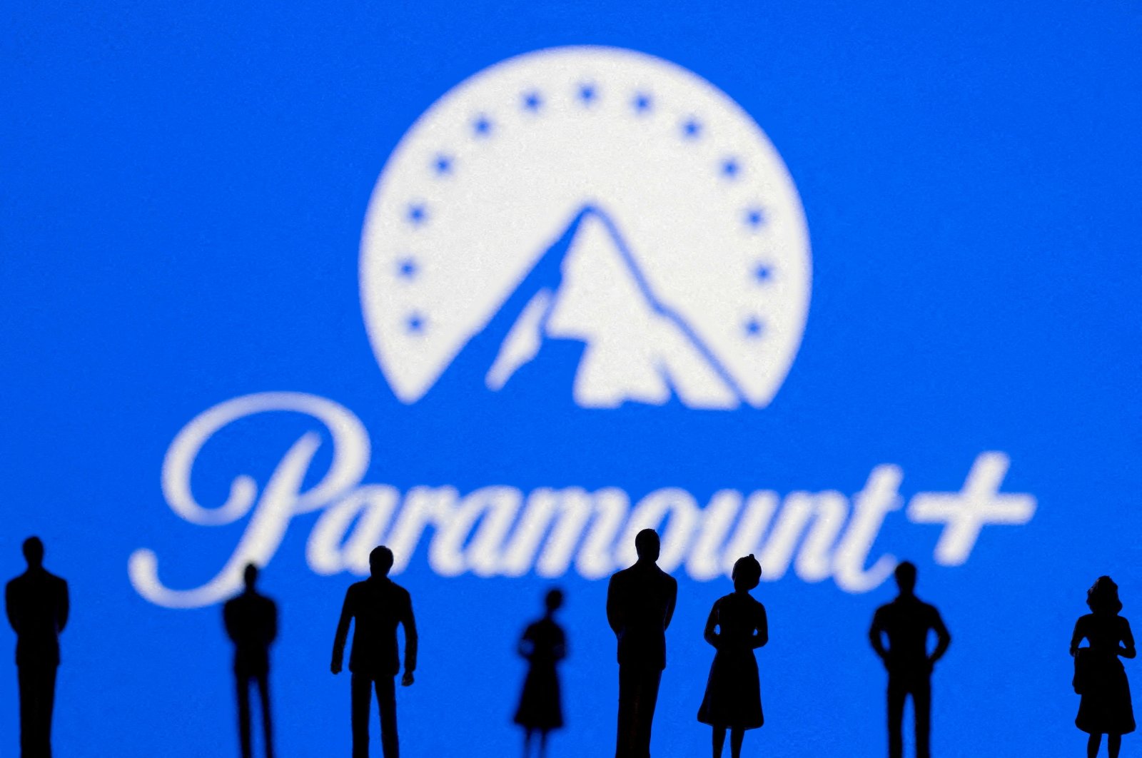 Toy figures of people are seen in front of the displayed Paramount   logo, in this illustration taken Jan. 20, 2022. (Reuters Photo)