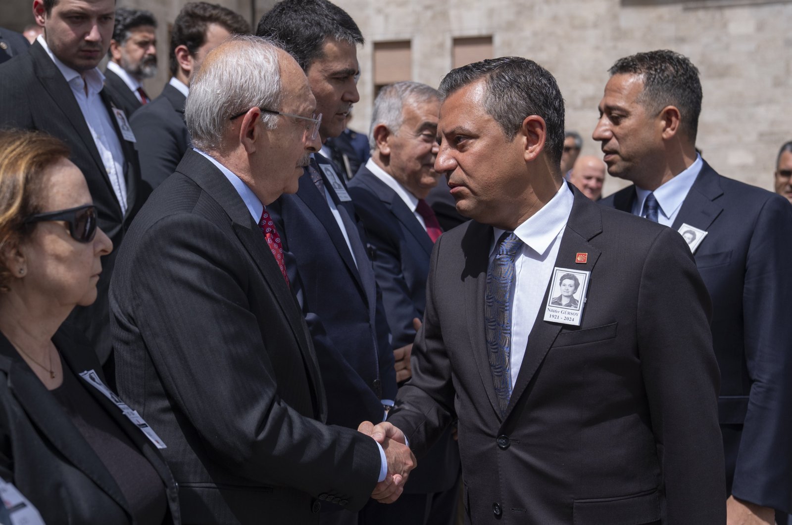 CHP Chair Özgür Özel (R) shakes hands with his predecessor Kemal Kılıçdaroğlu (L) during a funeral for a former lawmaker, Ankara, Türkiye, July 3, 2024. (AA Photo)