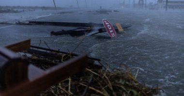Debris and flood waters from Hurricane Beryl cover the main roadway, Surfside Beach, Texas, U.S., July 8, 2024. (Reuters Photo)