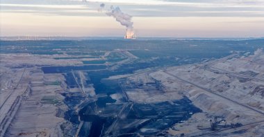 A lignite-fired power plant shines in the sun on the opposite side of the Hambach opencast mine, North Rhine-Westphalia, Niederzier, Germany, June 13, 2024. (Getty Images Photo)