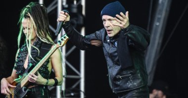 British singer Bruce Dickinson (R) performs at the Copenhell Rock and Metal Festival on the Refshaleoeen peninsula in the harbor of Copenhagen, Denmark, 19 June 2024. (EPA Photo)