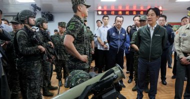 Taiwanese leader Lai Ching-te studies a rocket launcher during his visit to a military camp in Taoyuan, Taiwan, May 23, 2024. (Reuters Photo)