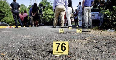 Bullet casings litter the ground behind a press conference. At least three people were killed and 10 others wounded in the shooting. Violence and mass shootings often surge in the summer months, especially around the 4th of July, historically one of the deadliest days each year, Shreveport, Louisiana, U.S., July 5, 2023. (AP Photo)