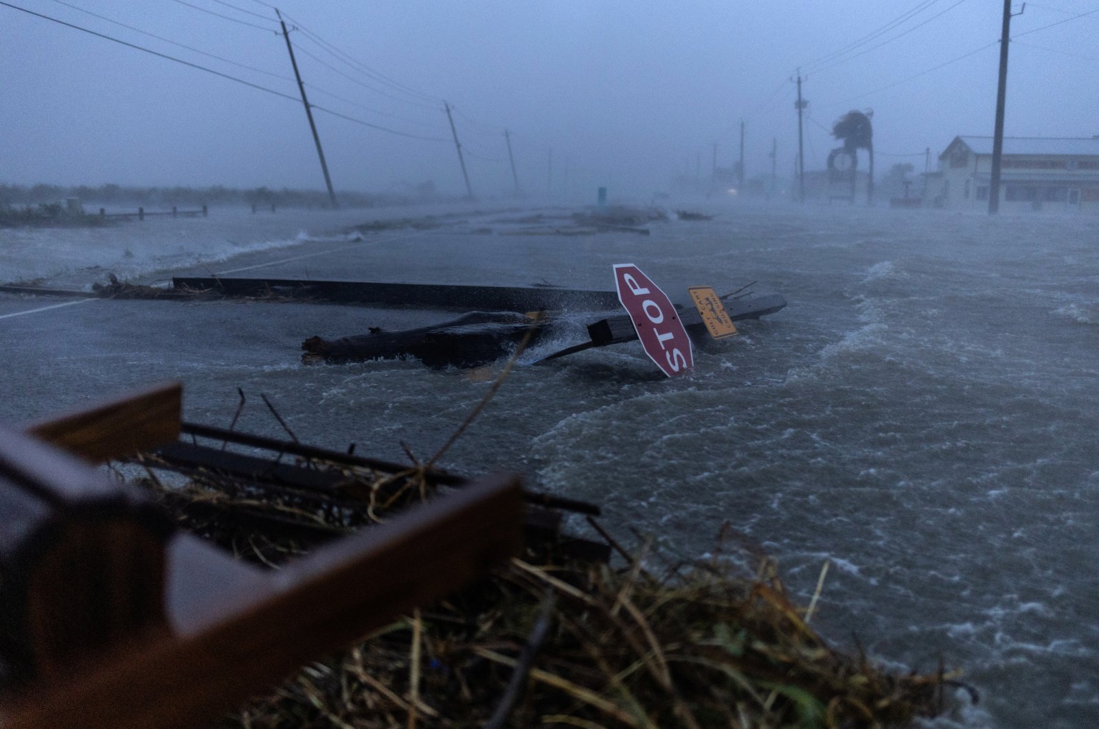 Debris and flood waters from Hurricane Beryl cover the main roadway, Surfside Beach, Texas, U.S., July 8, 2024. (Reuters Photo)