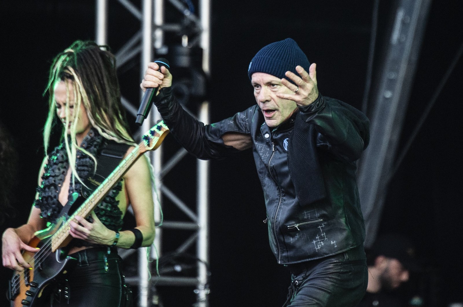 British singer Bruce Dickinson (R) performs at the Copenhell Rock and Metal Festival on the Refshaleoeen peninsula in the harbor of Copenhagen, Denmark, 19 June 2024. (EPA Photo)