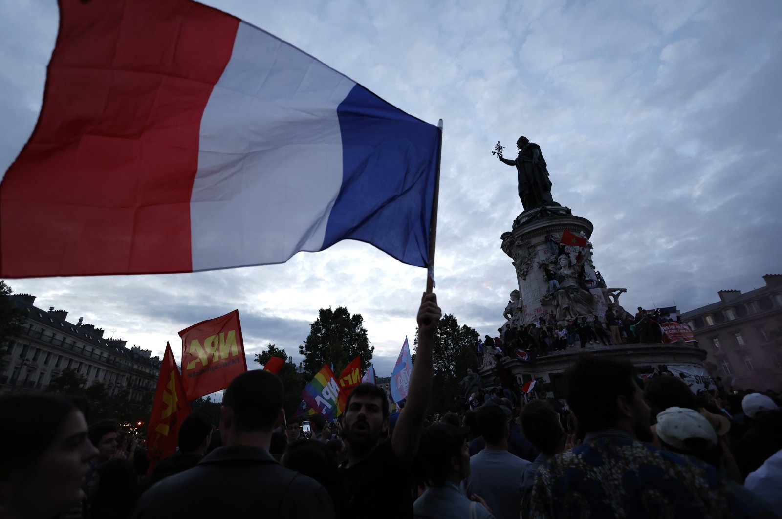 People gather on the Republique plaza following the second round of the legislative elections, Paris, France, July 7, 2024. (AP Photo)