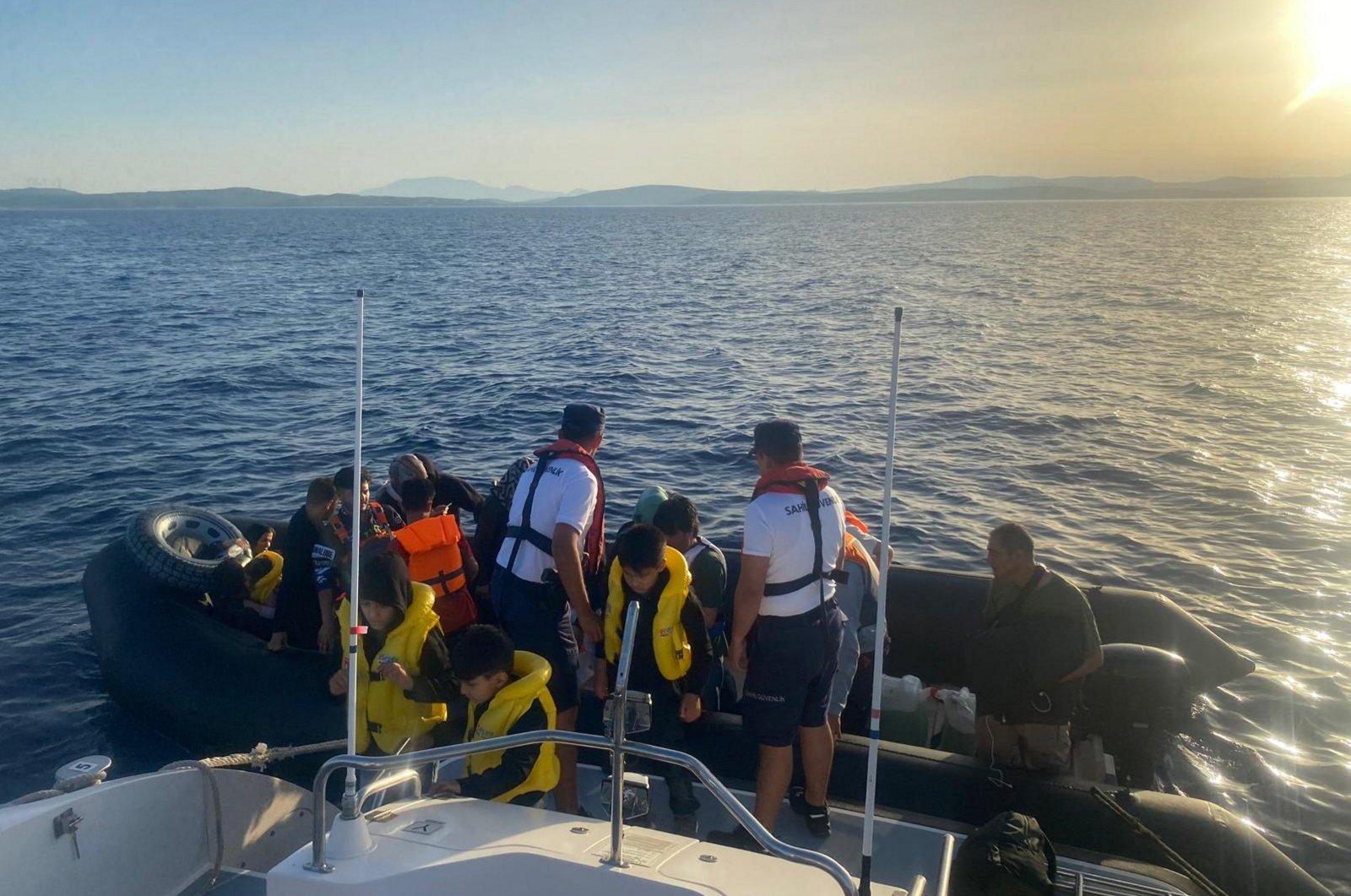 The Turkish Coast Guard Command escort irregular migrants intercepted off the coast of Izmir, western Türkiye, July 3, 2024. (AA Photo)