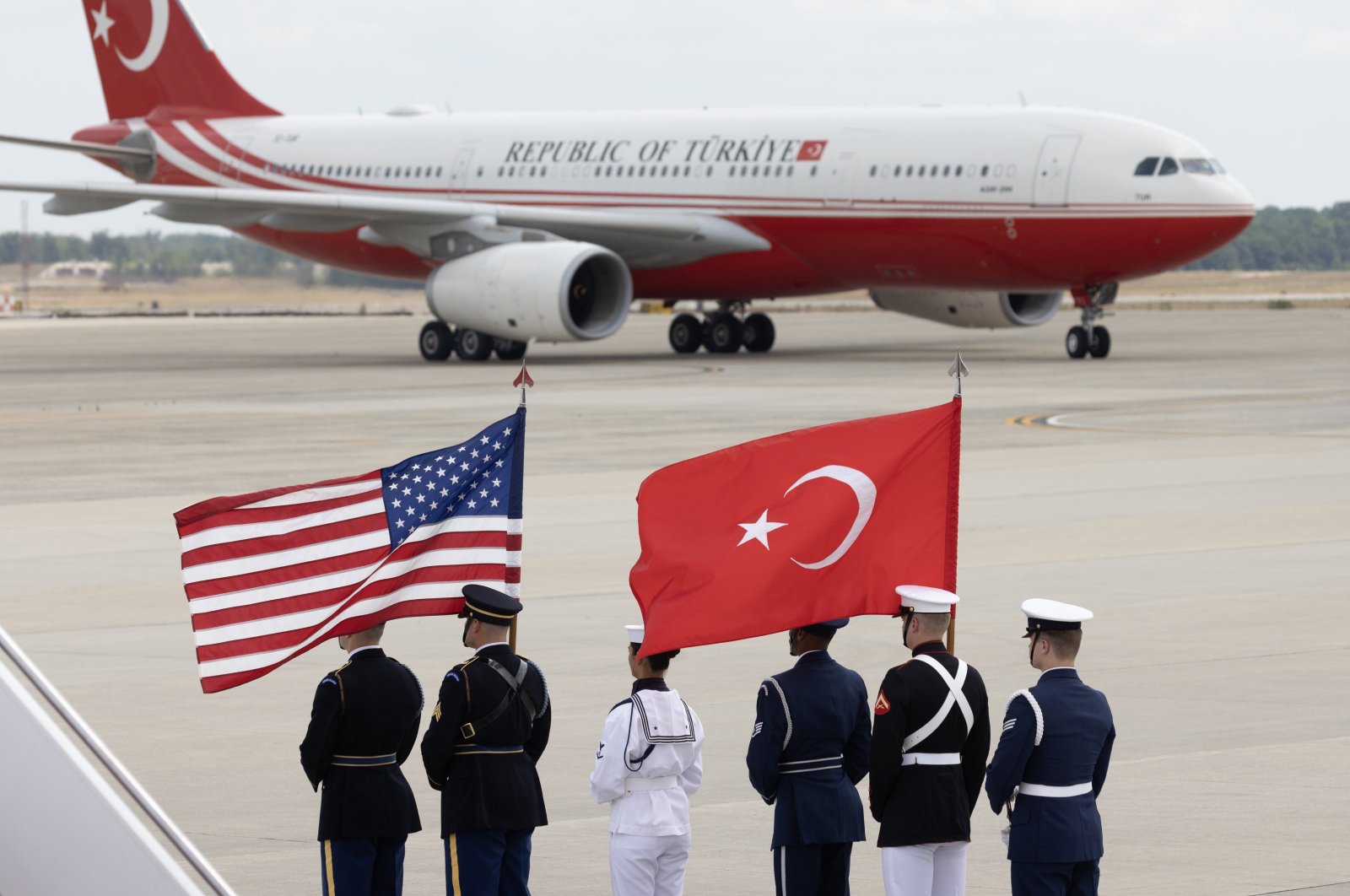 The national flags of the United States and Turkey are carried by a U.S. military color guard as an aircraft arrives carrying President Recep Tayyip Erdoğan (not pictured) at Joint Base Andrews, Maryland, July 9, 2024. (EPA Photo)