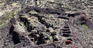 An aerial view of the ancient castle has been captured by a drone nestled among extinct lava streams near Çaldıran, Van, Türkiye, July 10, 2024. (IHA Photo)