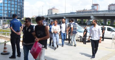 Police escort suspects involved in anti-Syrian riots, Antalya, southern Türkiye, July 4, 2024. (DHA Photo)