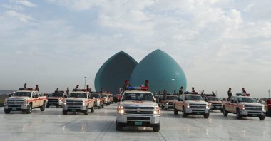 Military vehicles belonging to the Iraqi security forces carry the body remains of people from the minority Yazidi, who were killed by Daesh terrorists, after they were exhumed from a mass grave in Sinjar, during a funeral ceremony in Baghdad, Iraq Jan. 22, 2024. (Reuters File Photo)