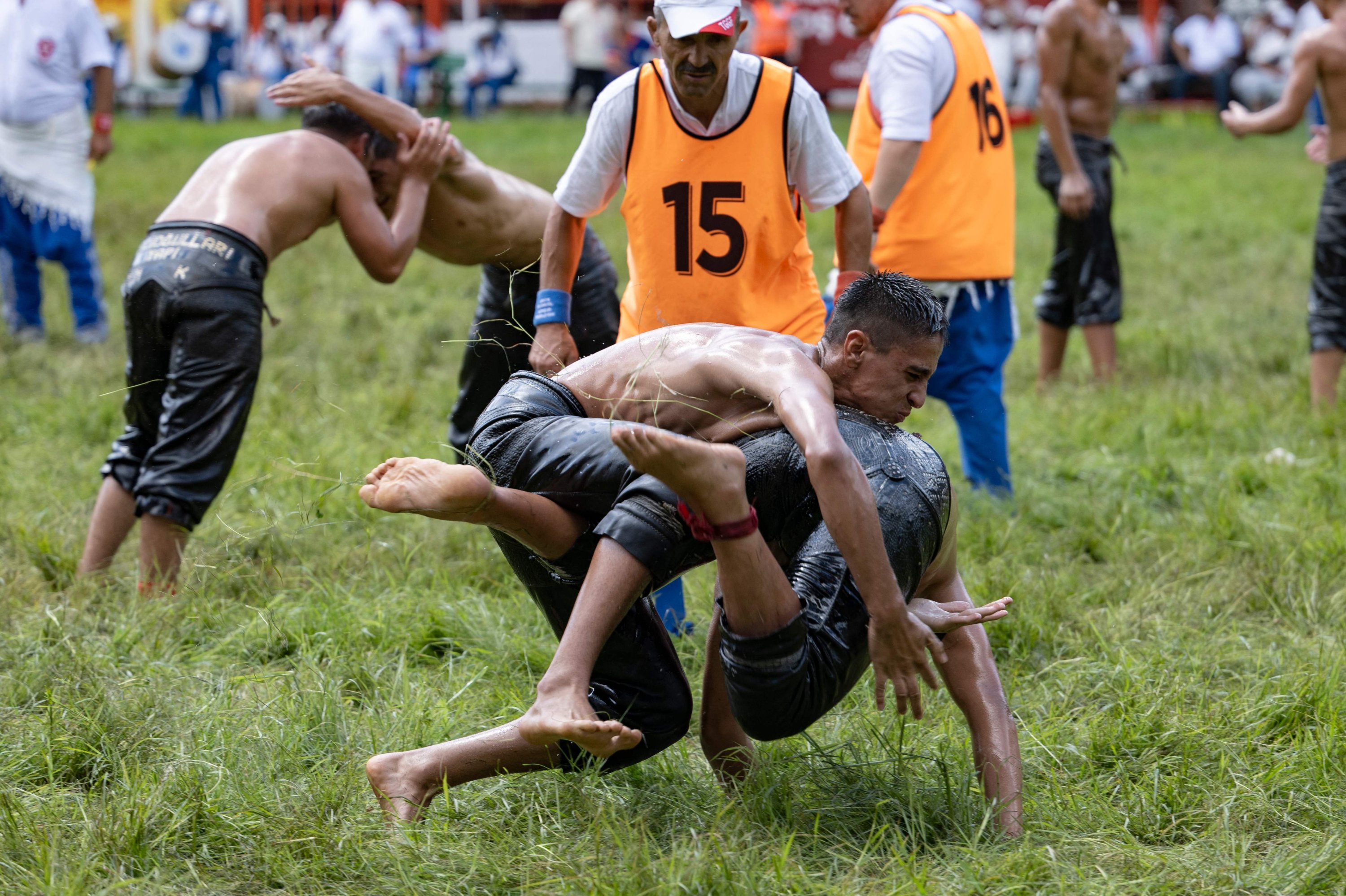 Wrestlers compete during the 663rd edition of the annual Historic Kırkpınar Oil Wrestling championship, Edirne, Türkiye, July 7, 2024. (AFP Photo)