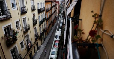 A person walks on the street of the rented flat where Carmen Cajamarca, 67, lives in the neighborhood of Lavapies, Madrid, Spain, June 10, 2024. (Reuters Photo)