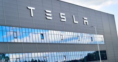 The logo of Tesla is seen on its gigafactory in Grunheide near Berlin, Germany, May 11, 2024. (Reuters Photo)