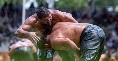 Wrestlers compete during the 663rd edition of the annual Historic Kırkpınar Oil Wrestling championship, Edirne, Türkiye, July 7, 2024. (AFP Photo)