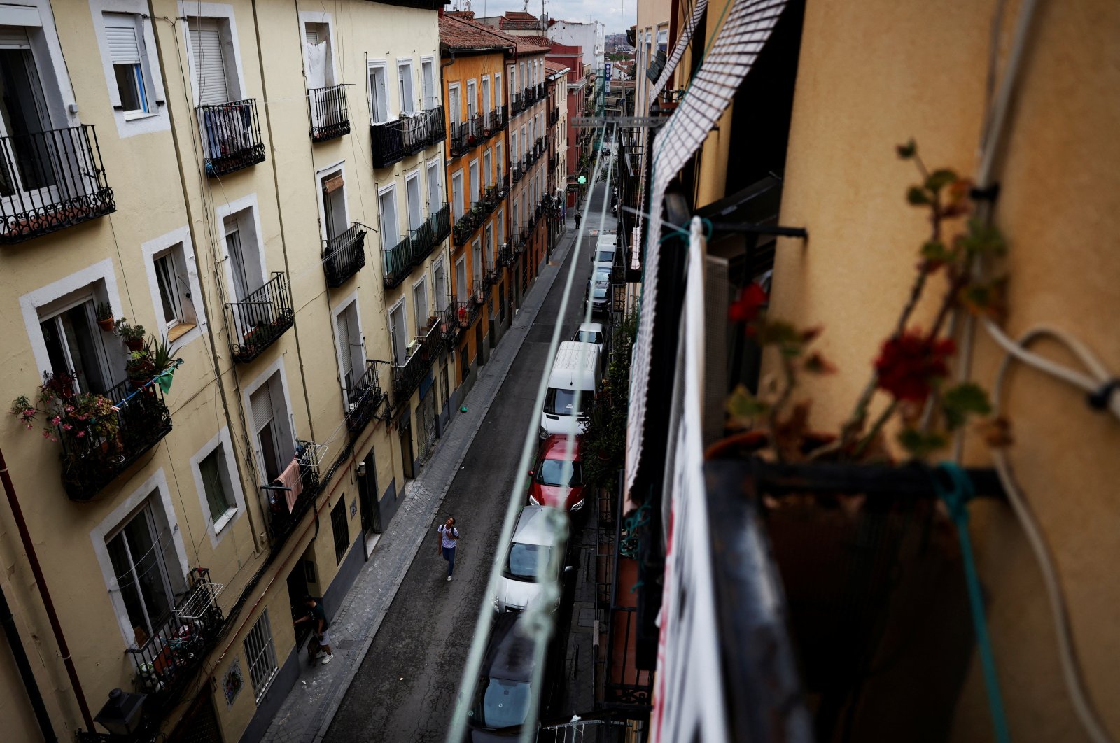 A person walks on the street of the rented flat where Carmen Cajamarca, 67, lives in the neighborhood of Lavapies, Madrid, Spain, June 10, 2024. (Reuters Photo)