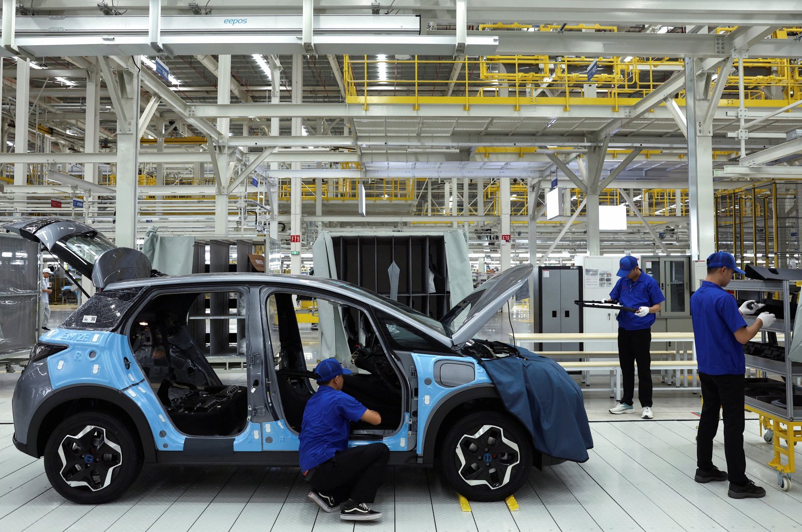 Workers assemble an EV car inside BYD&#039;s first electric vehicle factory in Southeast Asia, a fast-growing regional EV market where it has become the dominant player, Rayong, Thailand, July 4, 2024. (Reuters Photo)