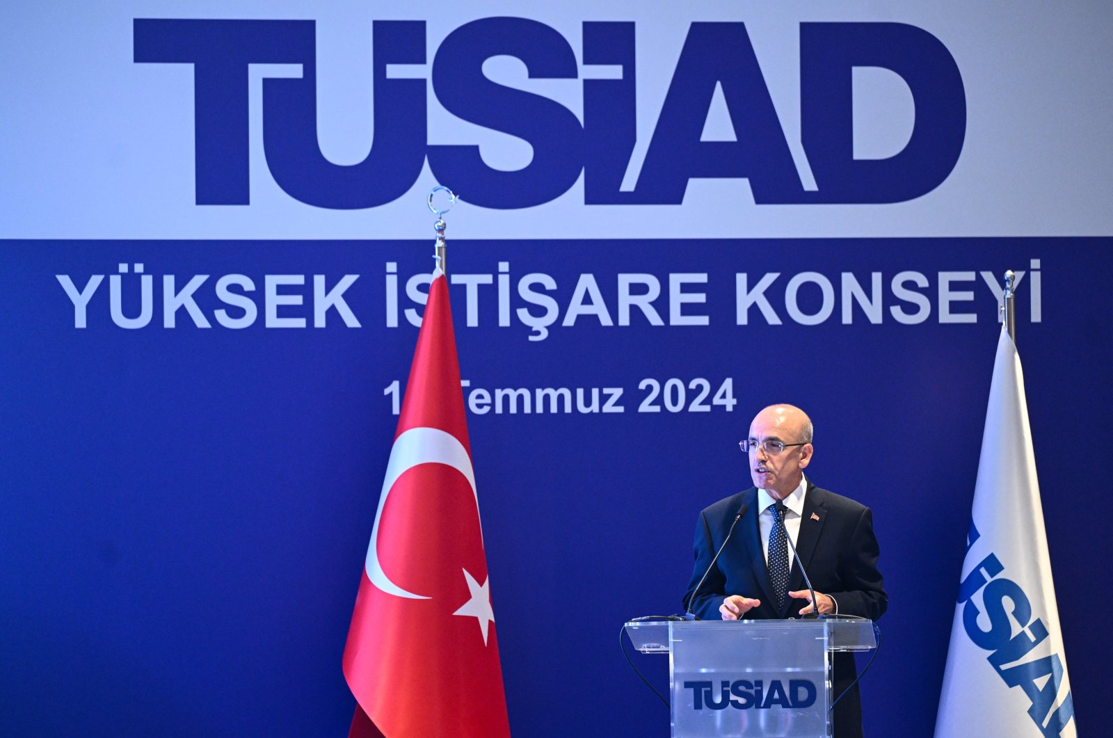 Treasury and Finance Minister Mehmet Şimşek delivers a speech at a high advisory board meeting of the Turkish Industry and Business Association (TÜSIAD), Istanbul, Türkiye, July 11, 2024. (AA Photo)