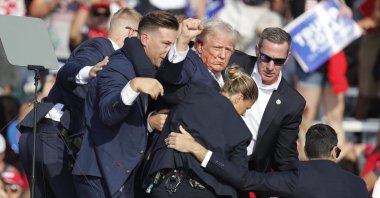 Former U.S. President Donald Trump is rushed off stage by Secret Service officers after being shot at during a campaign rally at the Butler Farm Show Inc. in Butler, Pennsylvania, U.S., July 13, 2024. (EPA Photo)