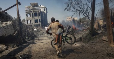Palestinians flee after an Israeli raid on the tents of displaced people in the al-Mawasi area of Khan Younis, in the southern Gaza Strip, Palestine, July 13, 2024. (EPA Photo)