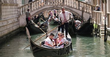 Day-trippers take a gondola tour, on the last day of the experimental 5 euro entry fee to visit Venice, Venice, Italy, July 14, 2024. (Reuters Photo)