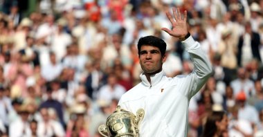 Spain's Carlos Alcaraz celebrates with his trophy after winning the men's final against Serbia's Novak Djokovic at the Wimbledon Championships, Wimbledon, London, U.K., July 14, 2024. (EPA Photo)