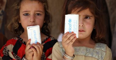 Afghan children show soap bars distributed by UNICEF during a polio vaccination drive in Kandahar, Afghanistan, July 8, 2024. (EPA Photo)