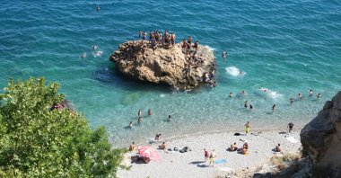 People take to swimming in the sea to beat the heat in Antalya, Türkiye, June 30, 2024. (IHA Photo) 